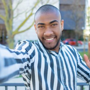 handsome-smiling-african-american-man-waving-min